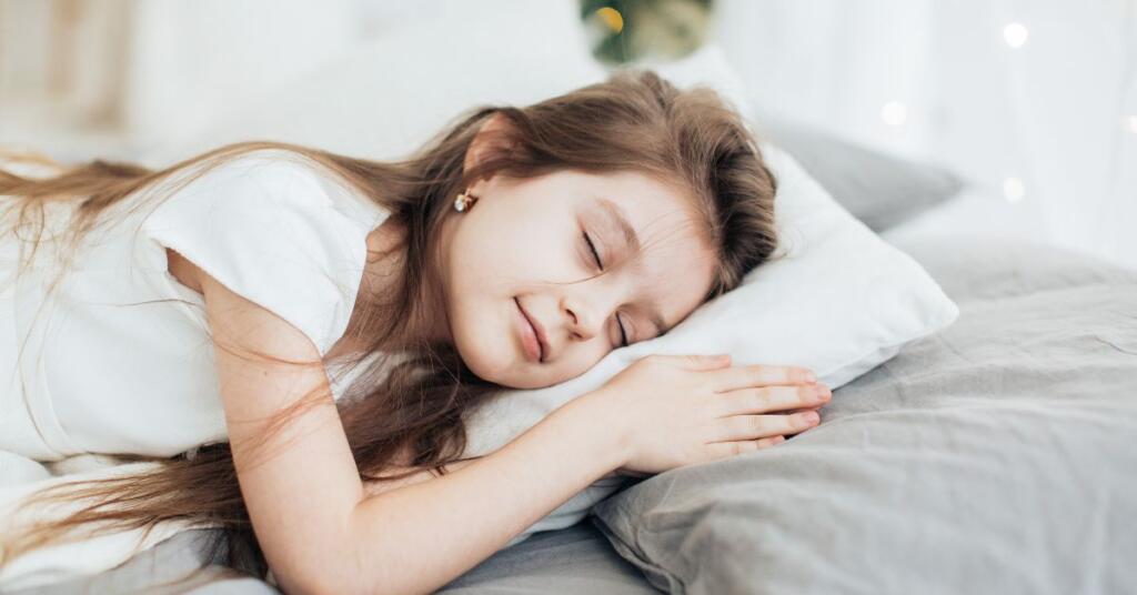 A girl sleeping on bed